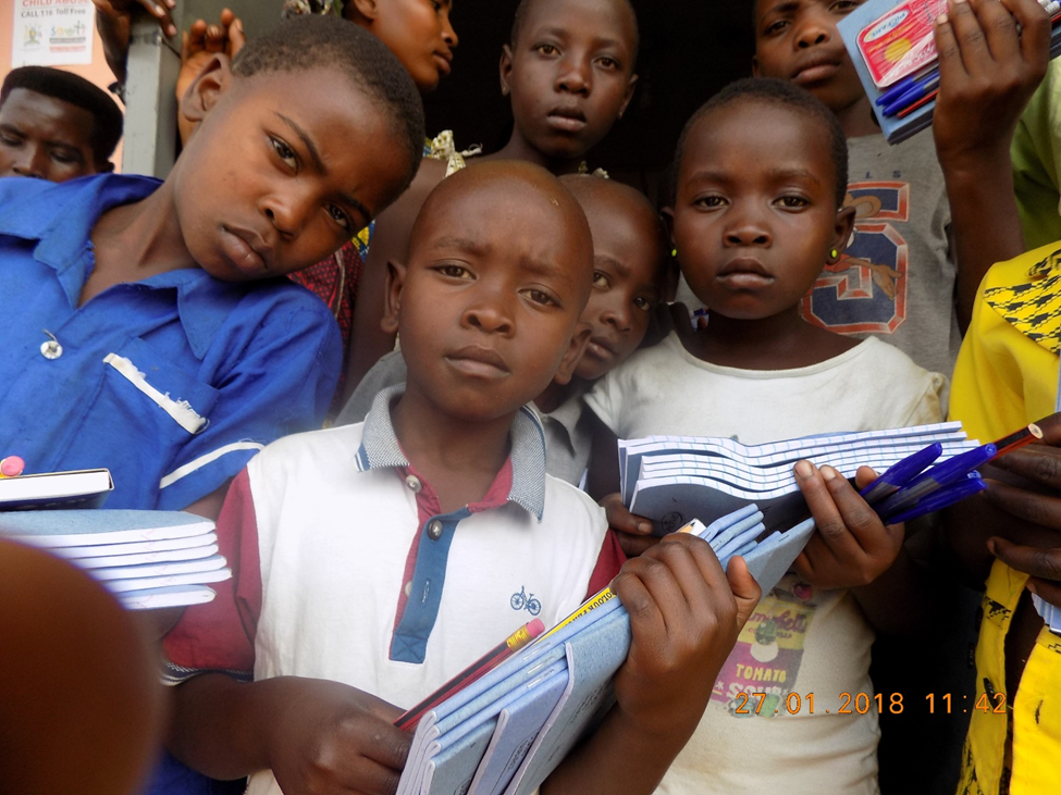 srh OVC beneficiaries receive scholastic Materials for education support